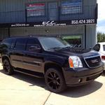GMC Denali with 22" KMC Slide wheels and Nitto tires.